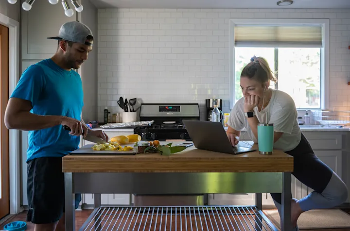 Developer returning attention to laptop screen